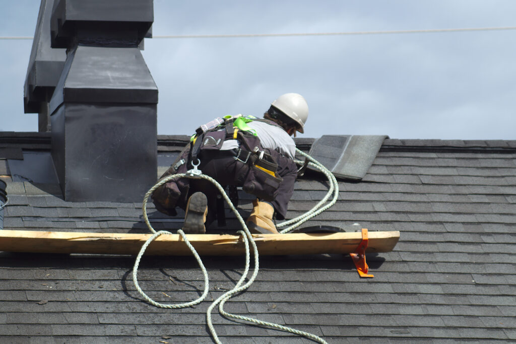 san antonio roofing contractor construction roof repair rope security worker