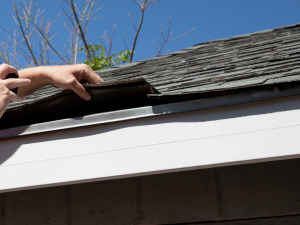 Roof inspection in progress during winter in San Antonio.