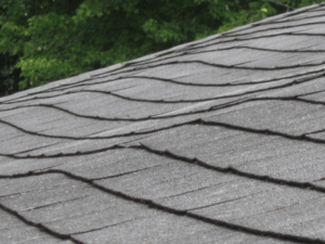 Sagging roof shingles with visible damage, highlighting the need for roof repairs in Universal City.