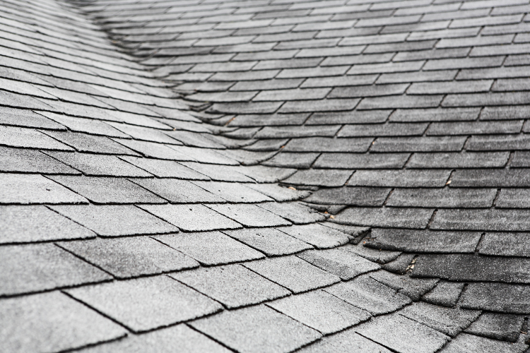 Old San Antonio roof shingles damaged by summer heat need professional repairs.